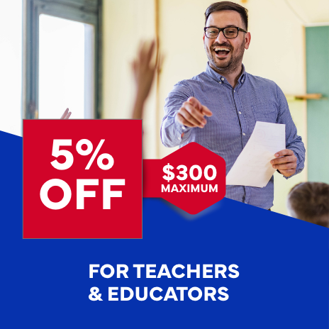 A man is holding a piece of paper in front of a sign that says 5 % off for teachers and educators