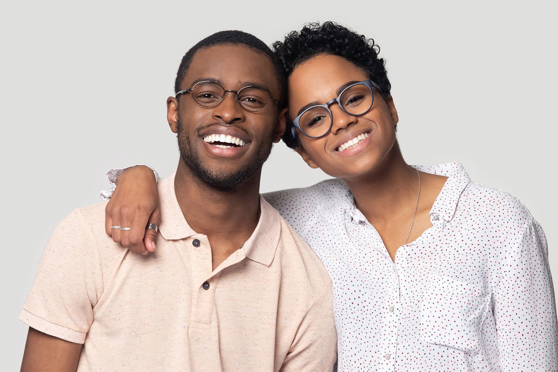 Couple With Healthy Teeth and Wearing Eyeglasses