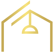 Een gouden icoon van een huis met een lamp aan het plafond.