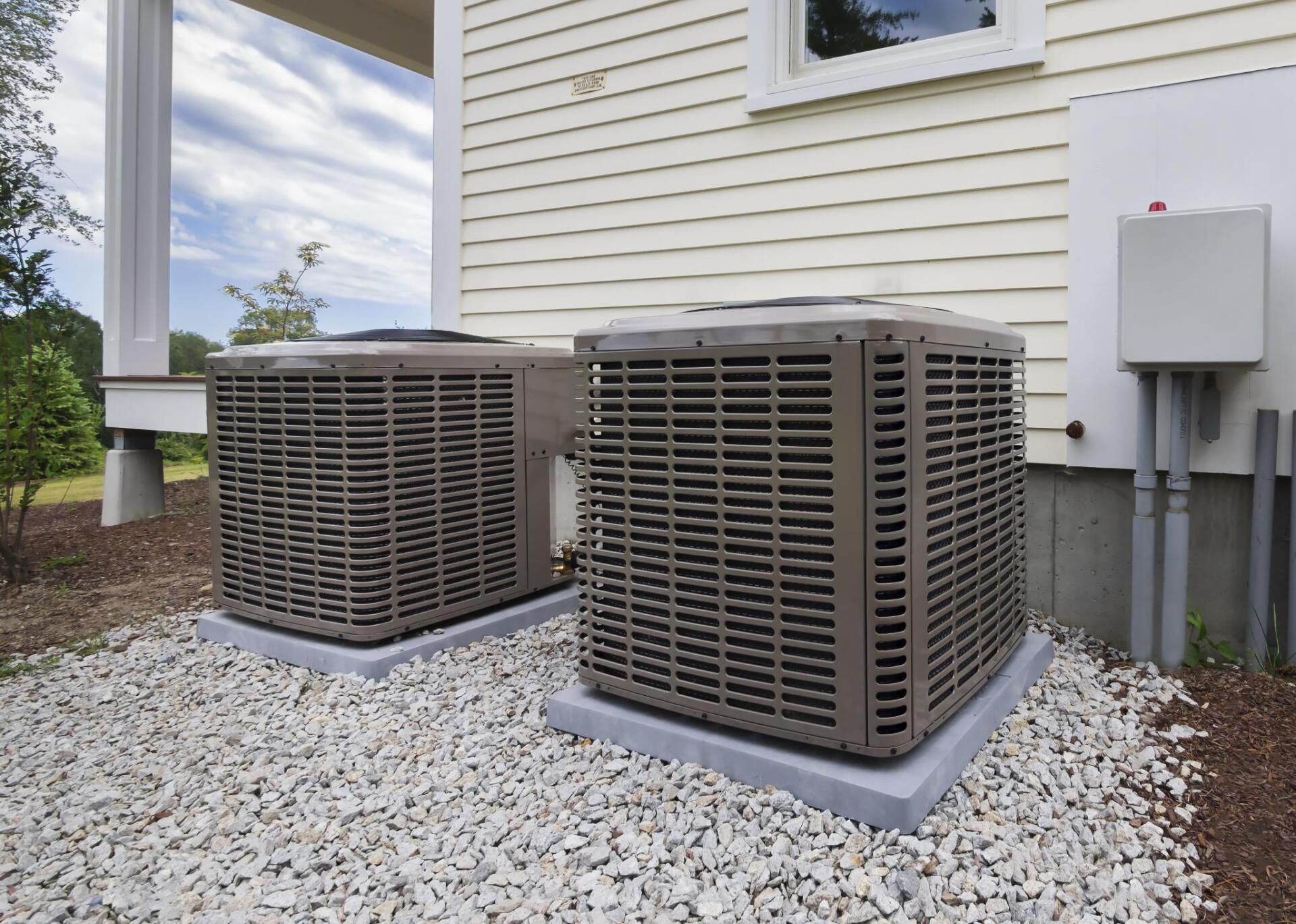 two air conditioner outside the house