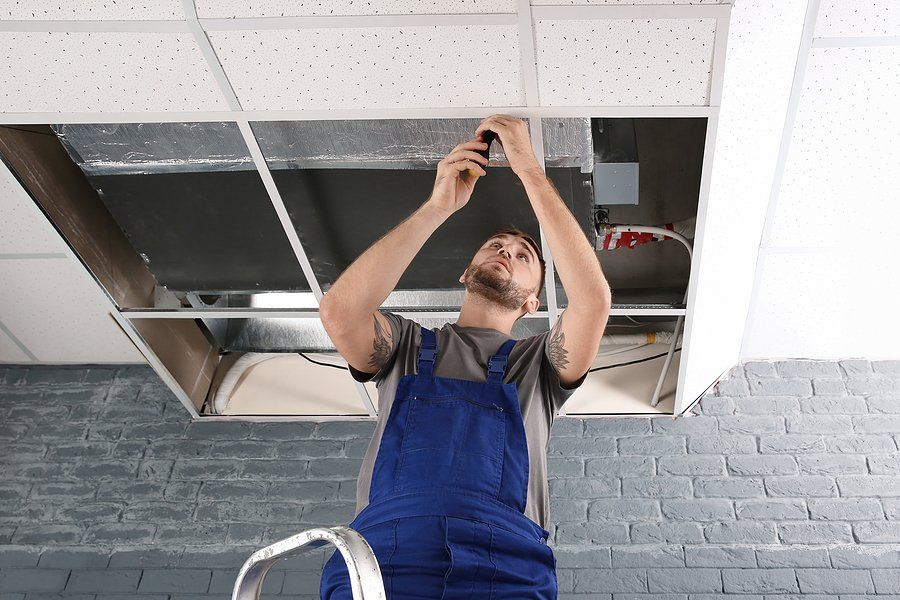 man fixing the ceiling