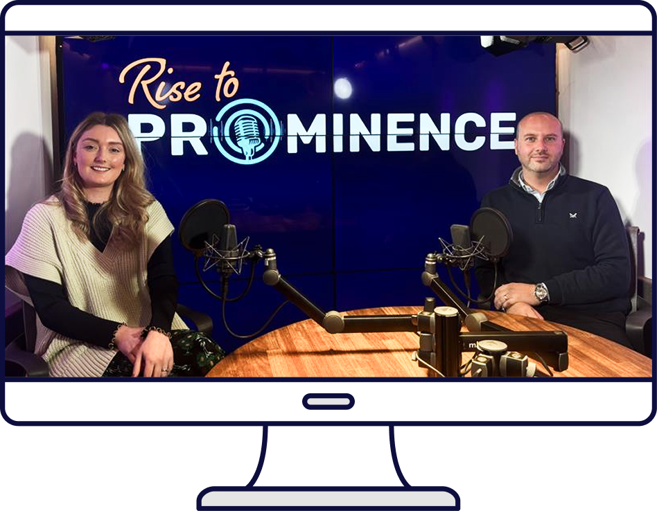 A podcast recording: Two people at a table with microphones, 