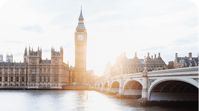 Big Ben and the Houses of Parliament in London, seen from across the River Thames at sunset.