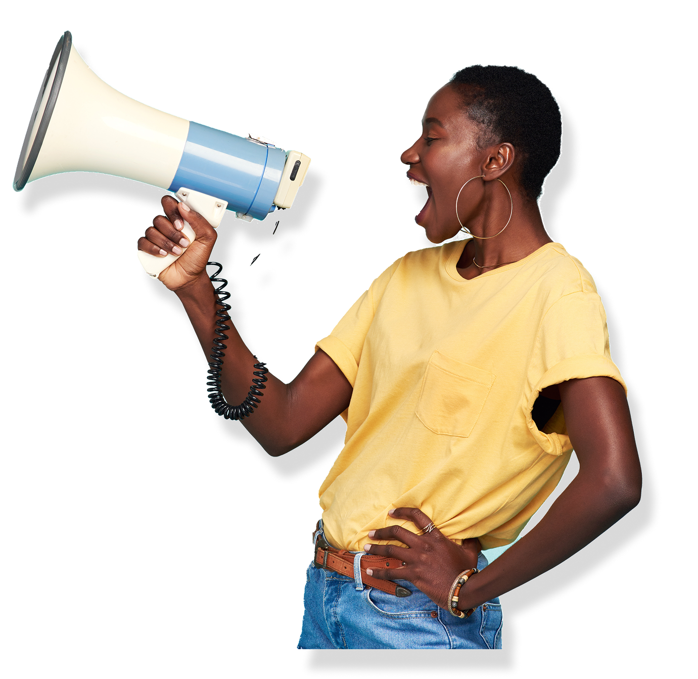 Woman shouting into a megaphone, wearing a yellow shirt and blue jeans.
