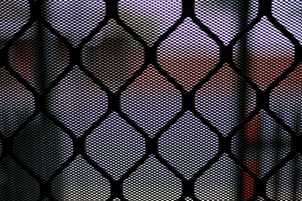 Black metal security screen with diamond pattern. — Kincumber Glass & Glazing in Kincumber, NSW