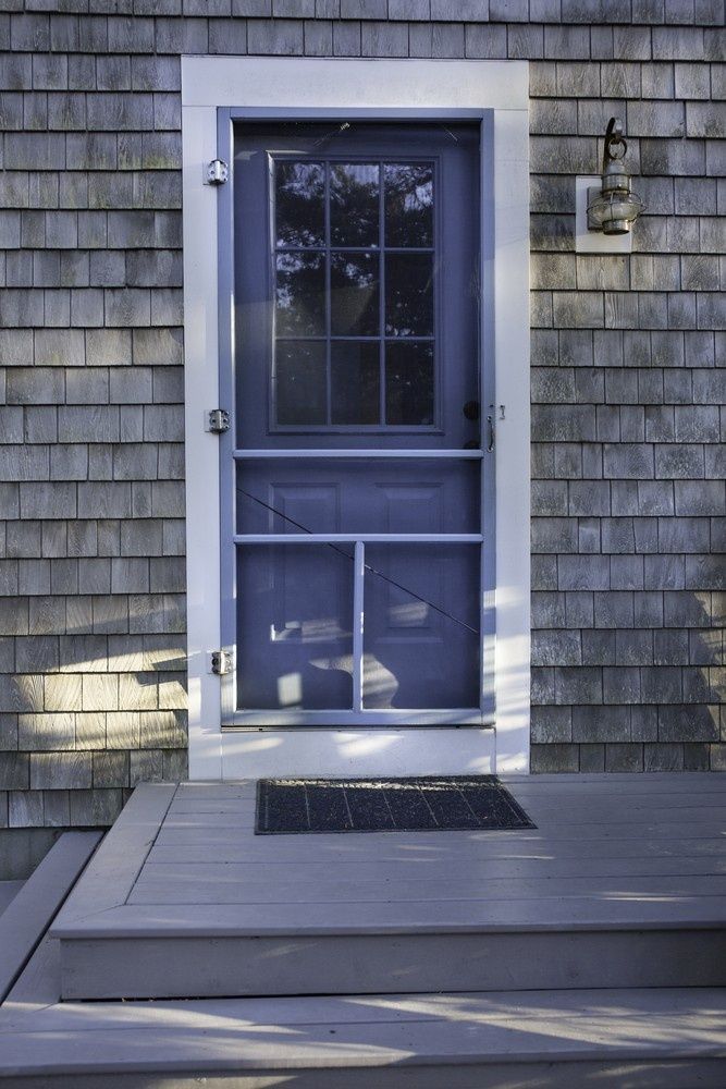 A Purple Screen Door is on the Side of a House — Kincumber Glass & Glazing in Kincumber, NSW