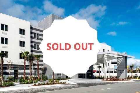 A building with a sold out sign in front of it