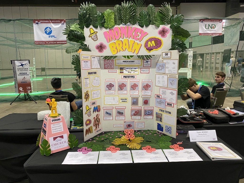 A monkey board is sitting on top of a table at a convention.