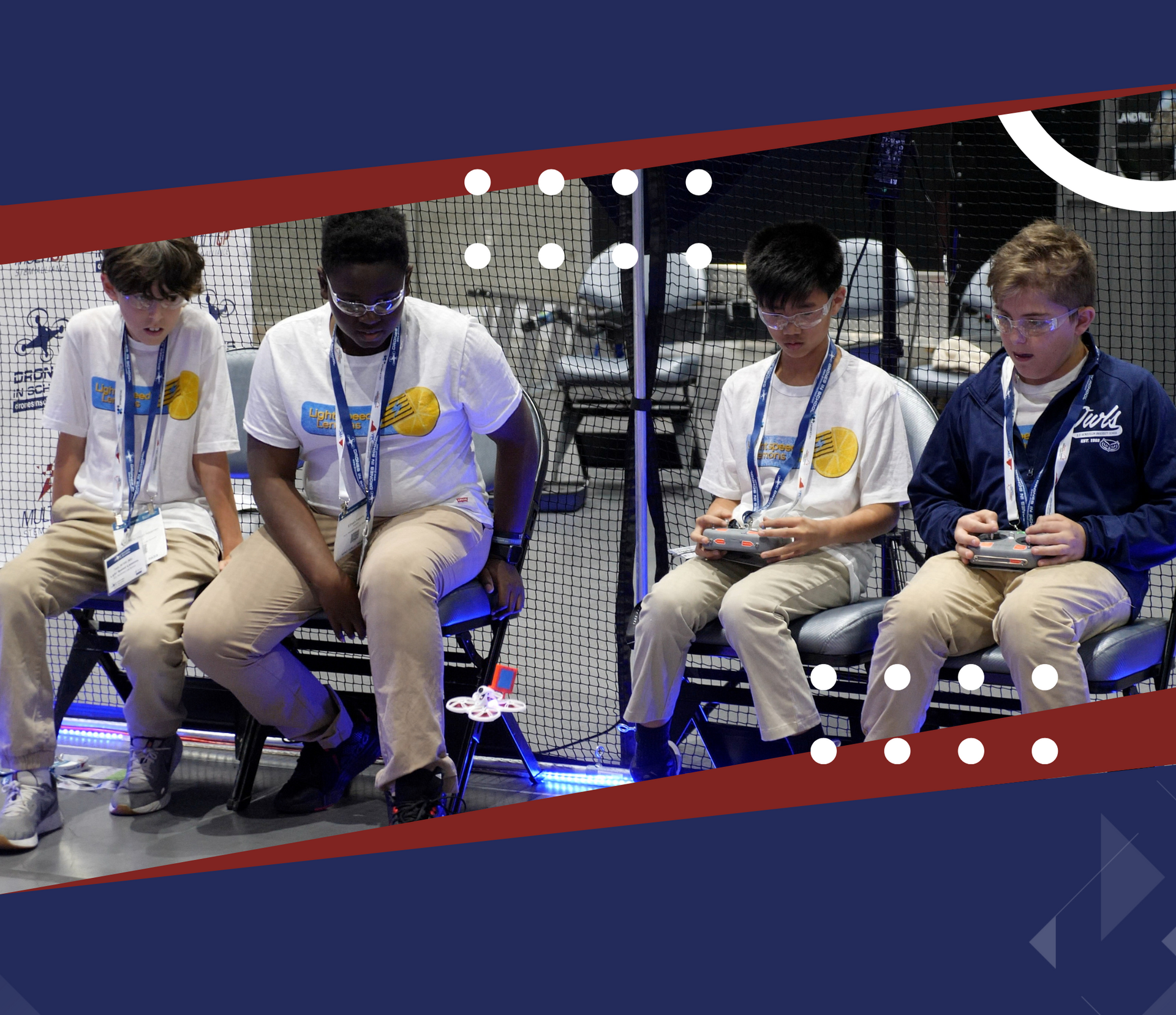 A group of young boys are sitting on chairs playing video games.