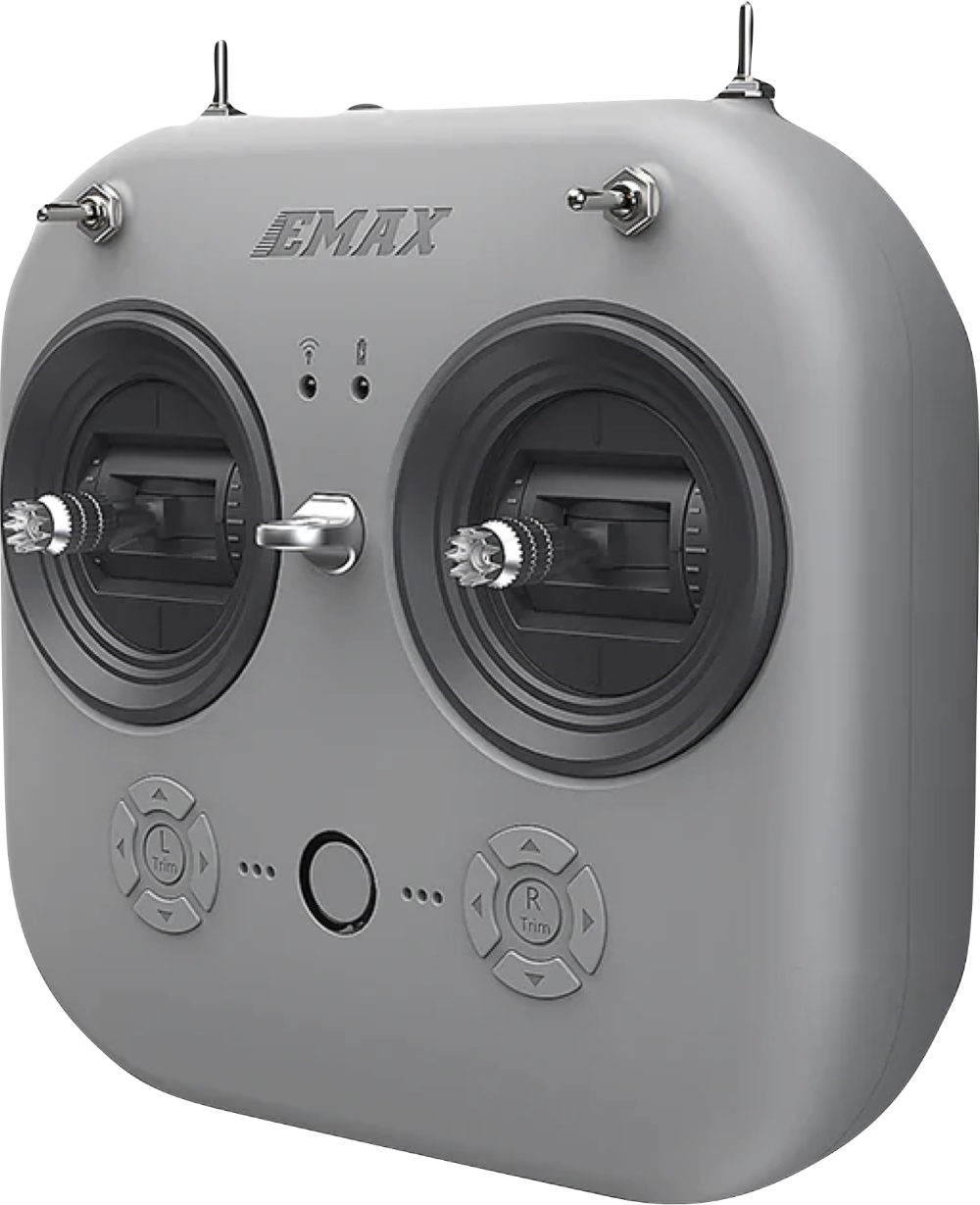 A gray remote control for a drone is sitting on a white surface.