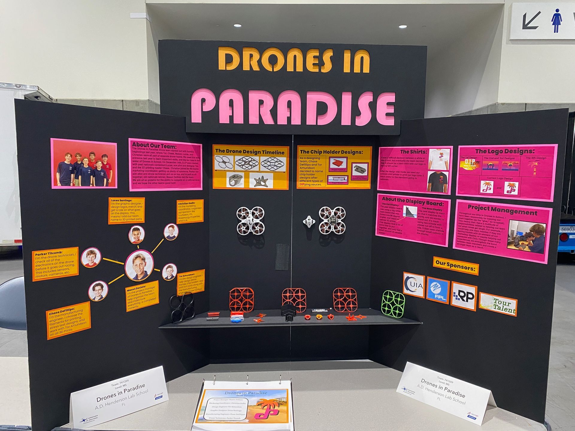 A display board that says drones in paradise on it