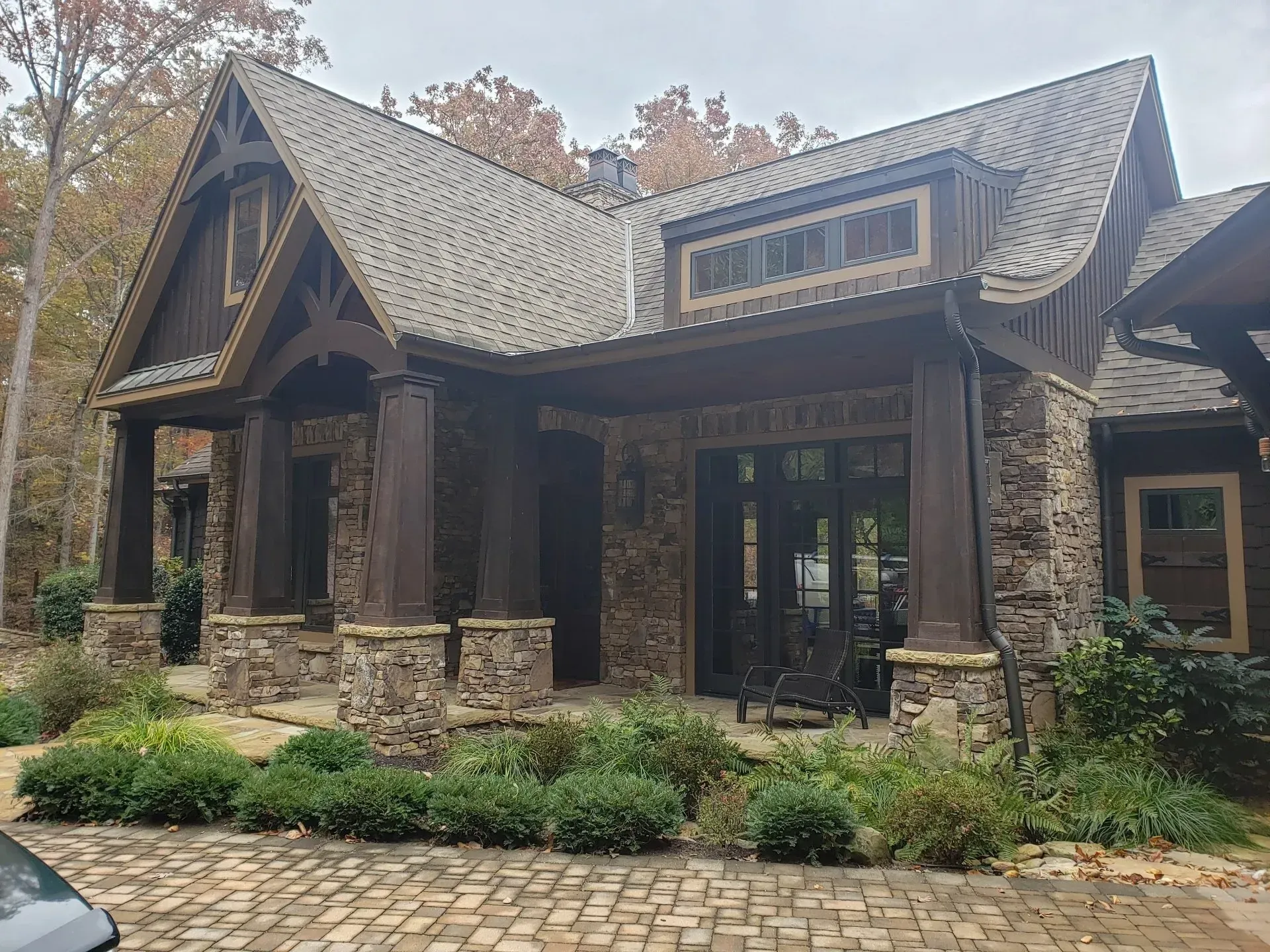 A large house with a car parked in front of it