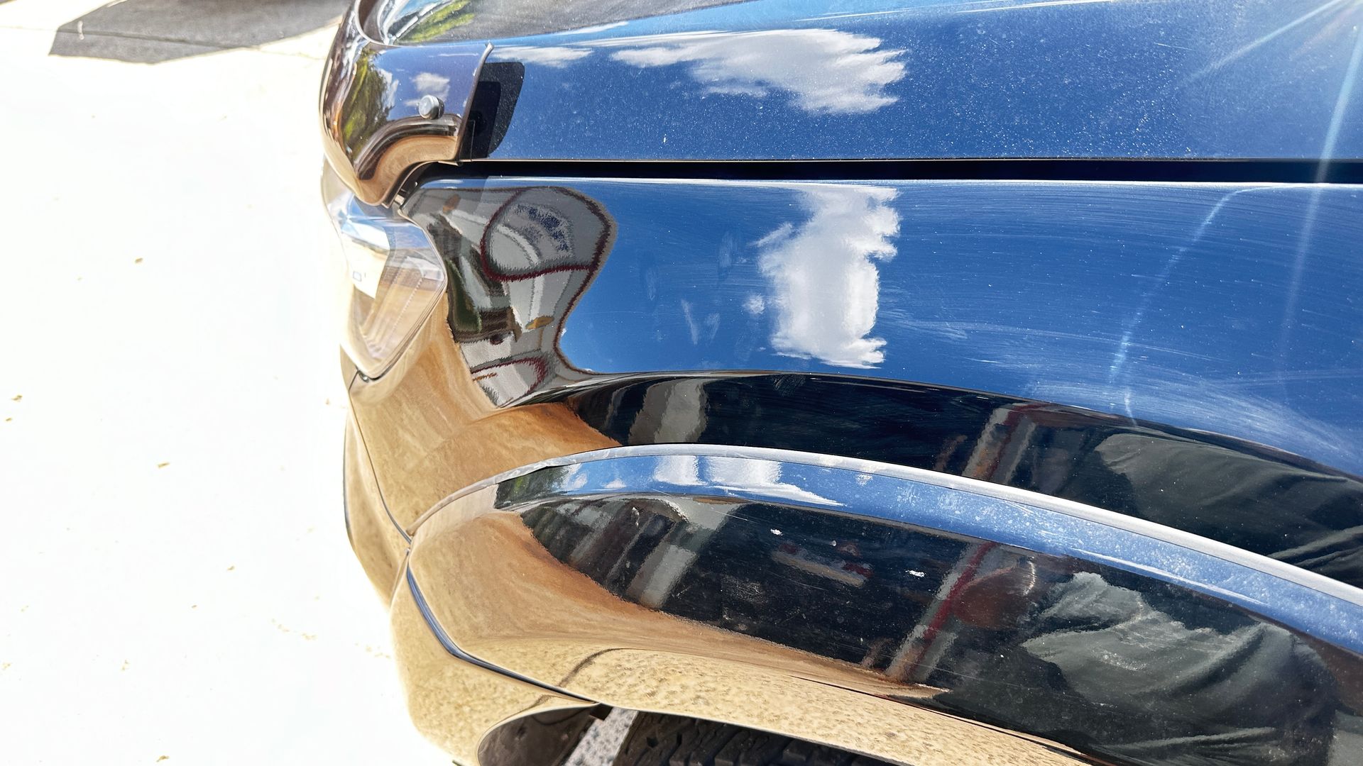 Black Car Wheel Arch With A Scratch — Dent Repair Specialist in Kunda Park, QLD