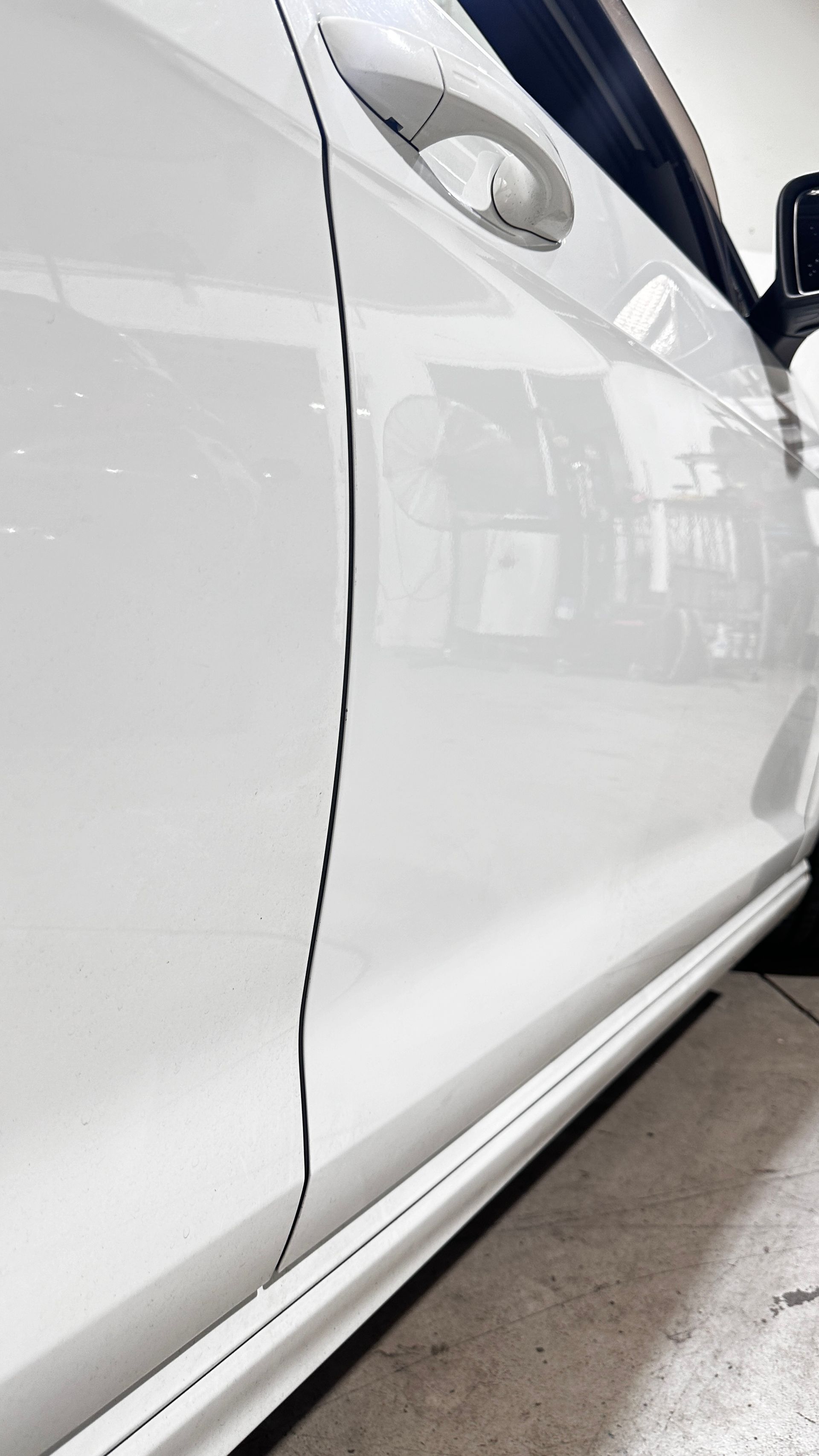 White Car Door With A Fixed Dent 2 — Dent Repair Specialist in Kunda Park, QLD