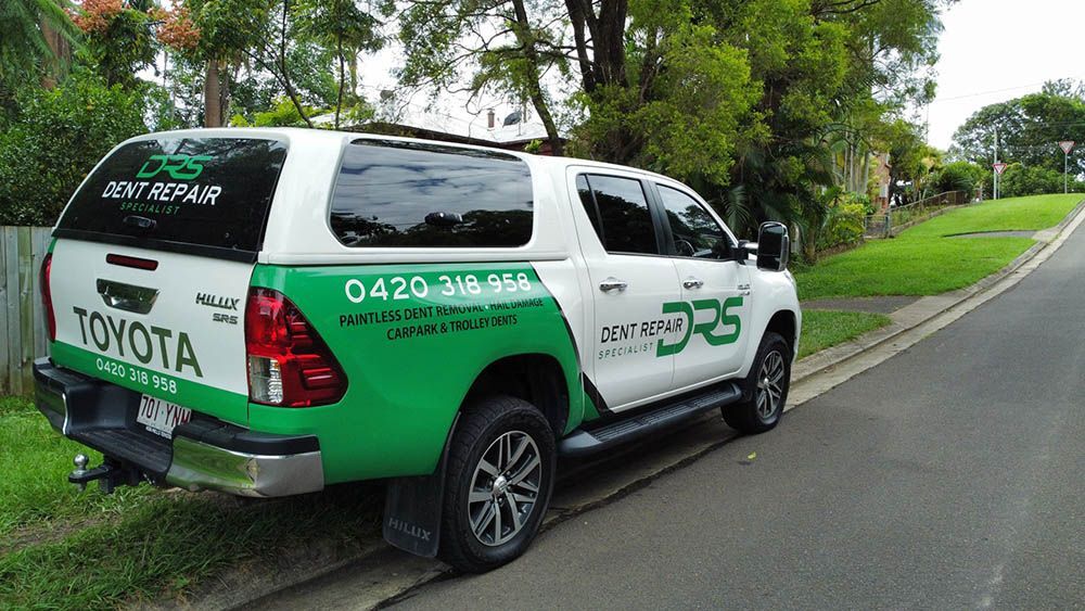 Side View of A White and Green Pickup Truck — Dent Repair Specialist in Kunda Park, QLD