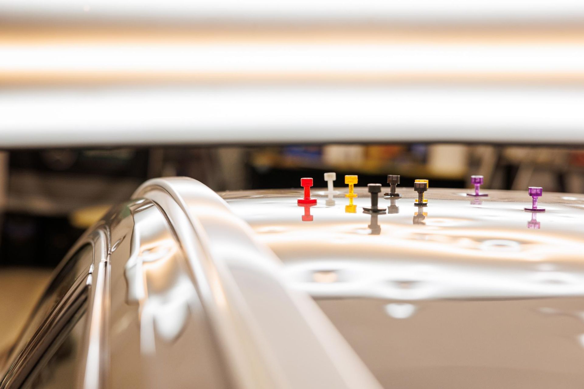 A Close up Of a Car's Roof with A Bunch of Pins on It — Dent Repair Specialist in Caboolture, QLD