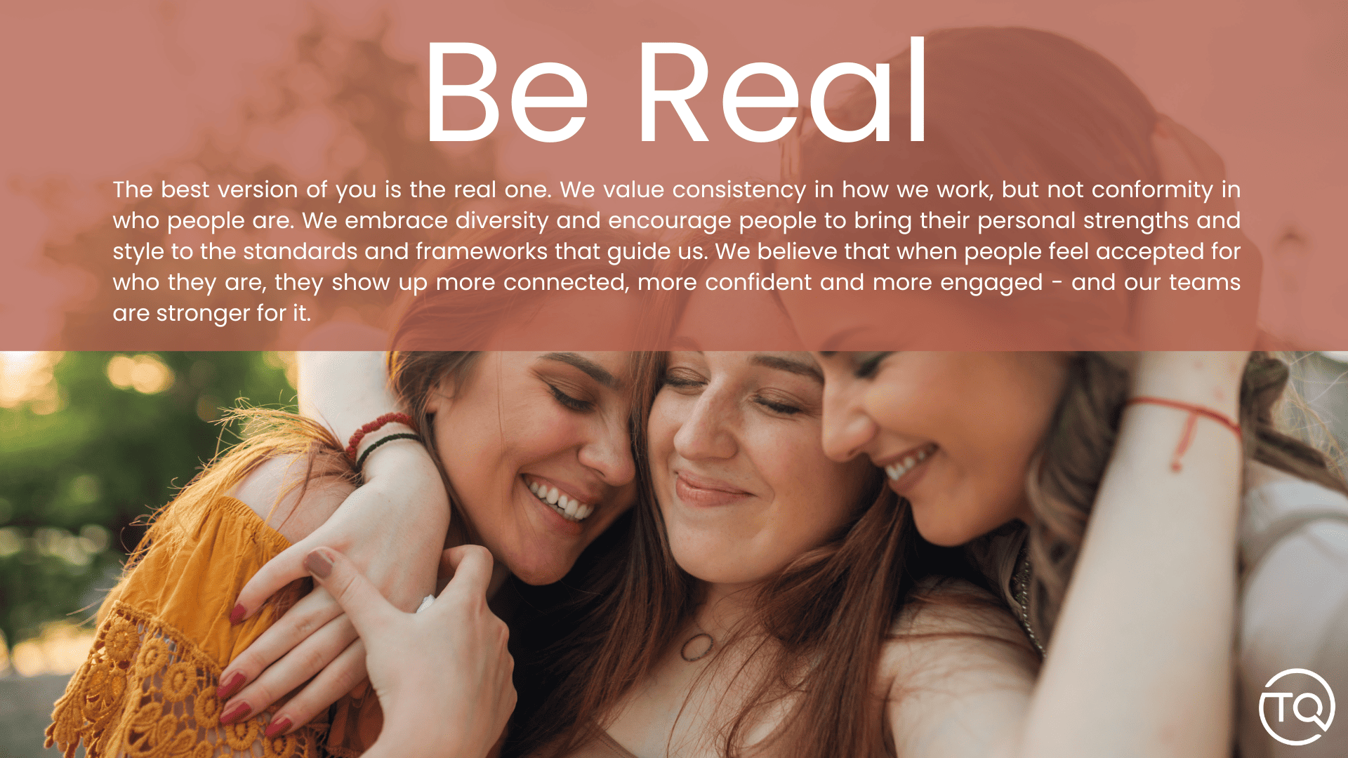 Three smiling women embracing under “Be Real” text on a peach banner
