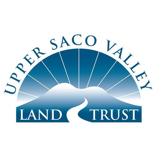 Upper Saco Valley Land Trust logo with blue sunburst and river over mountains