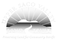 Upper Sac Valley Land Trust logo with sunrise over hills and a winding river