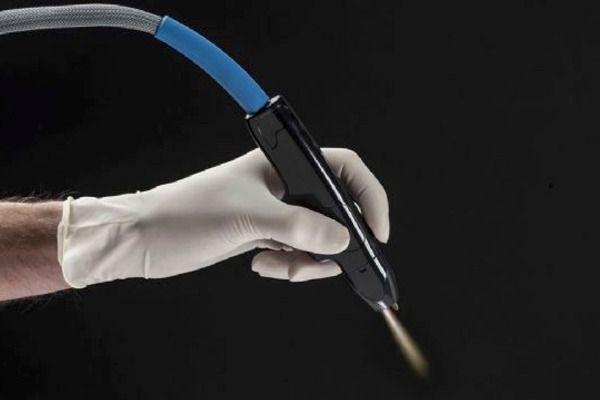 The NeoGen PSR handpiece delivering nitrogen plasma energy during a plasma skin resurfacing treatment
