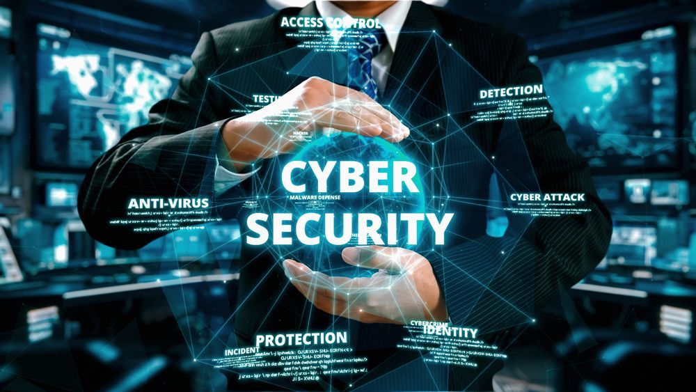 A man in a suit and tie is holding a globe with the words cyber security written on it.