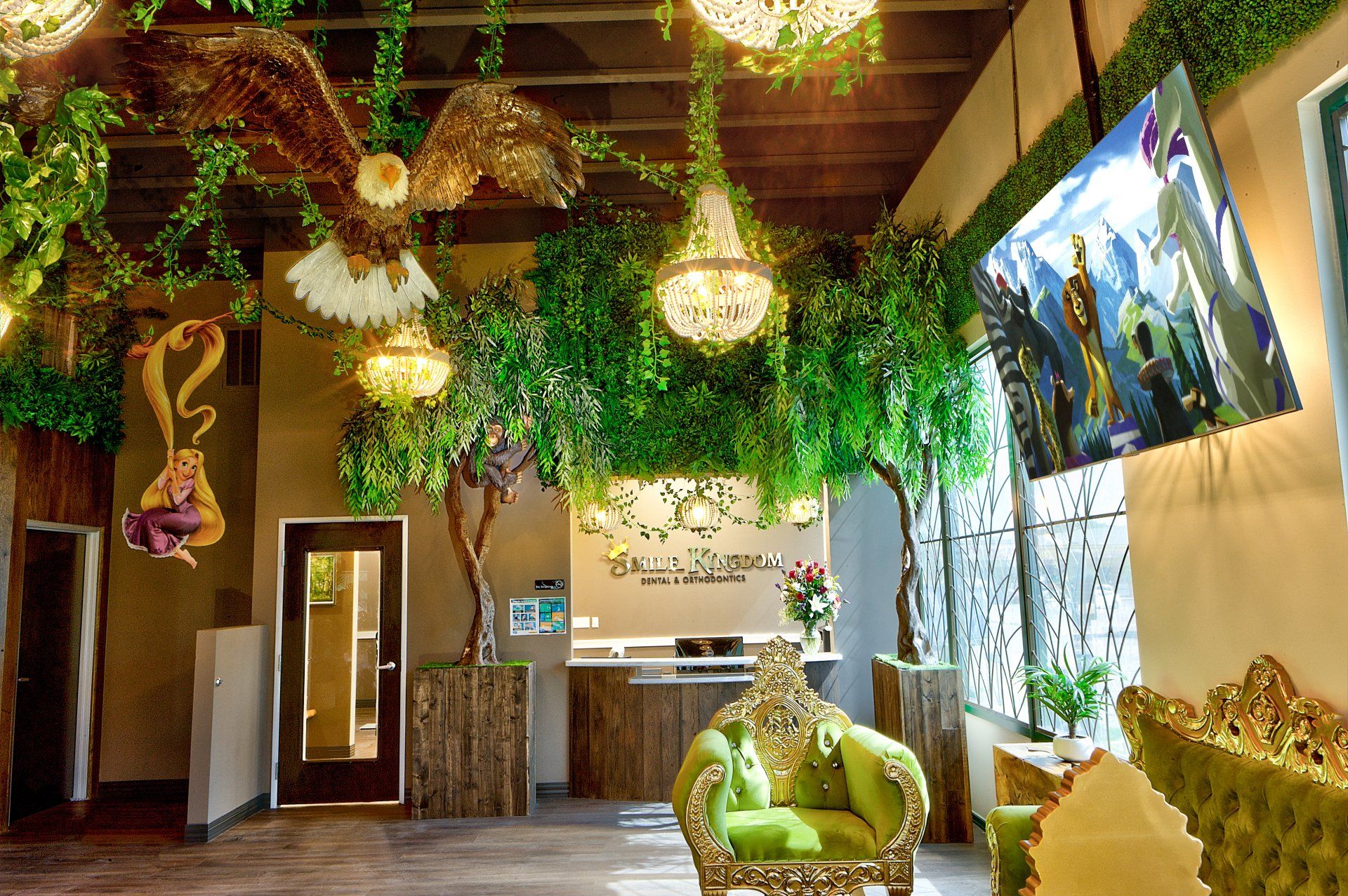 Tropical indoor lounge with hanging plants, wicker chairs, warm lights, and large jungle mural