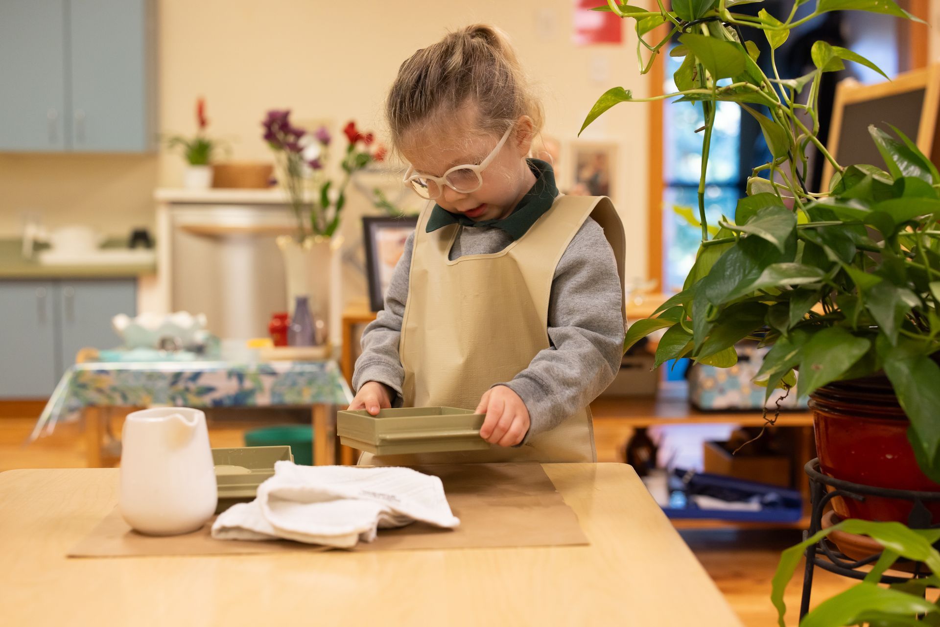 Montessori children working with language materials