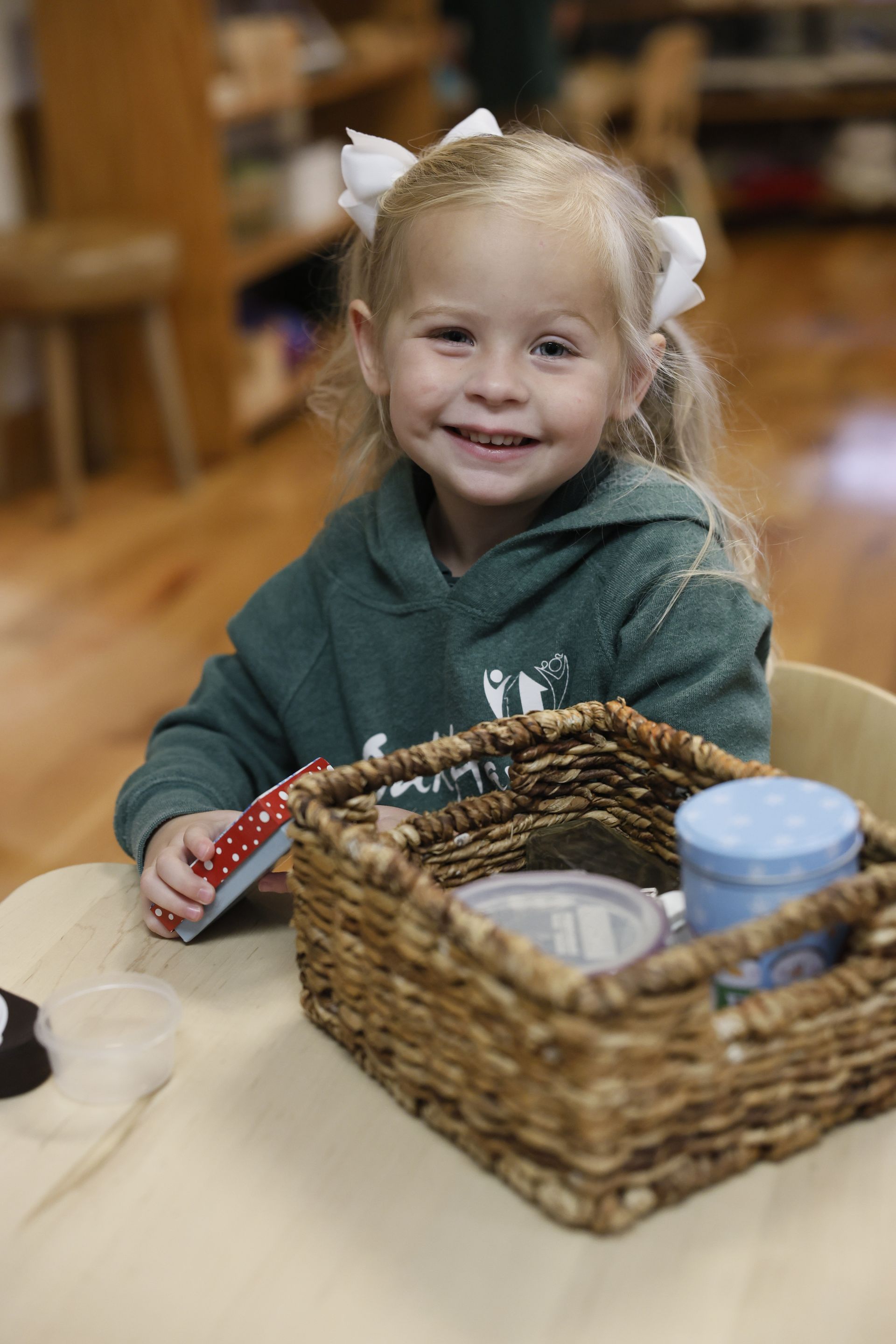 Montessori child working with practical life materials