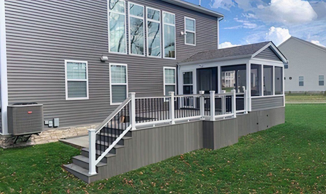 Back deck and stairs on a gray house, with white railings and a screened porch.