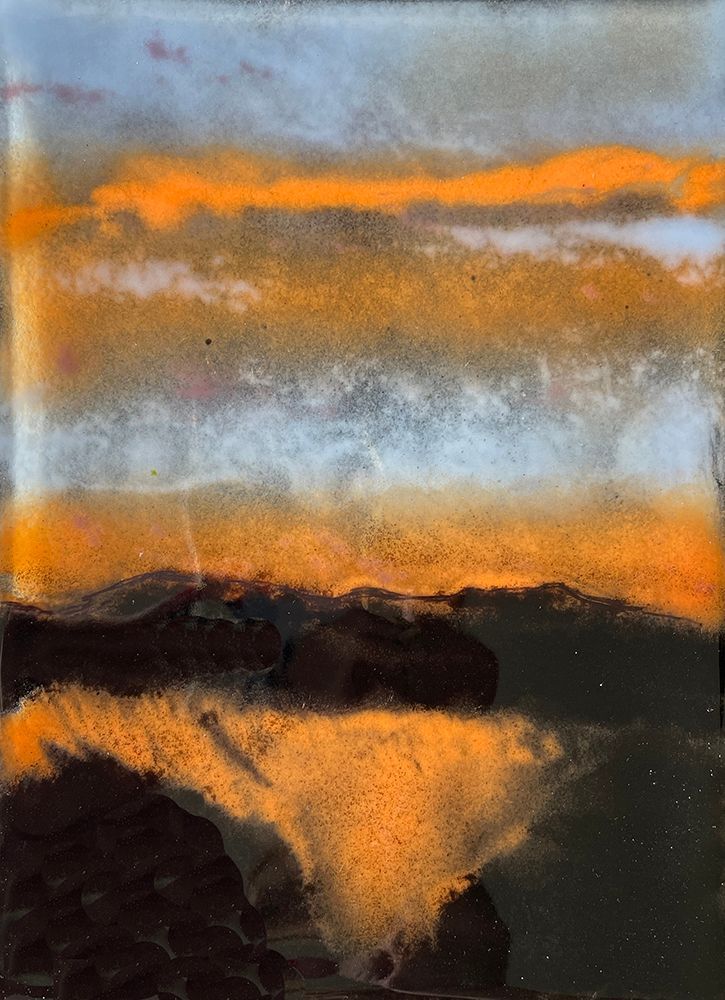 a glass art panel of the aftermath of a wildfire