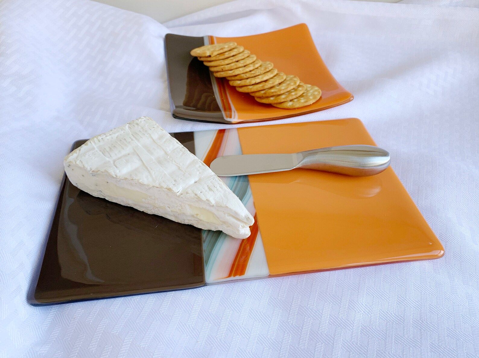 orange brown fused glass cheese board, cookie number, brie cheese with spreader