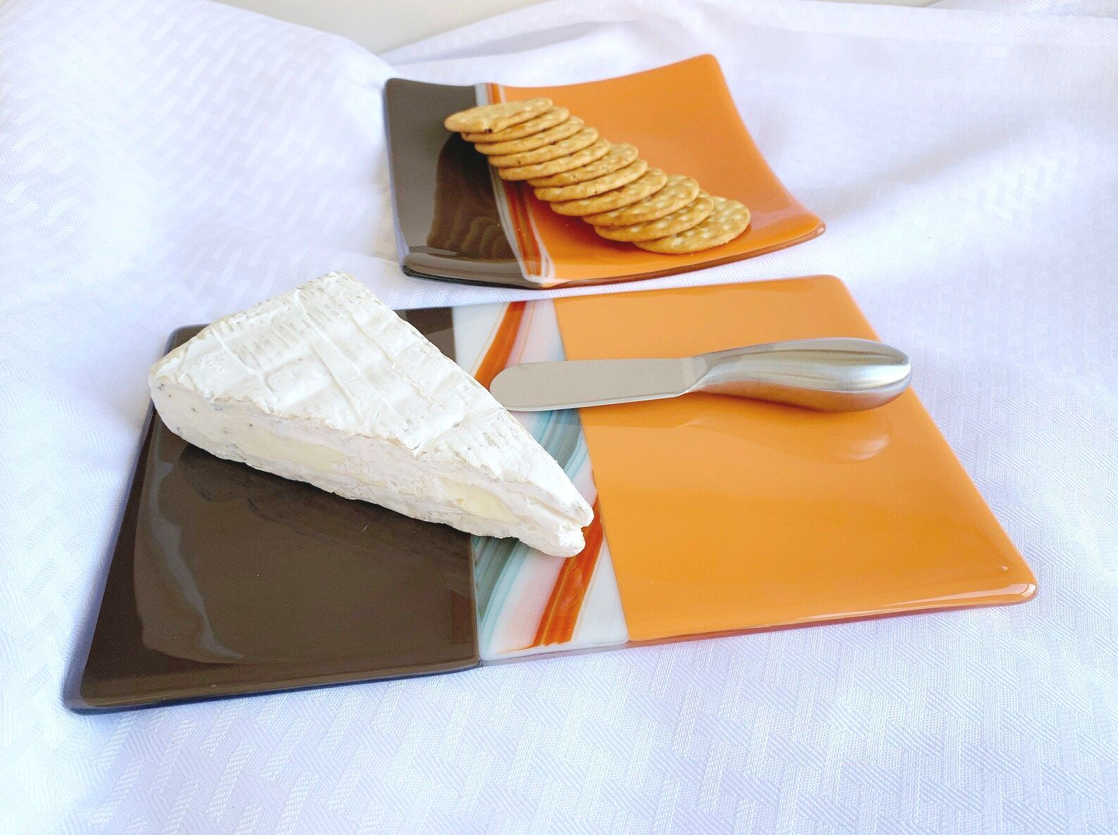 orange brown fused glass cheese board, cookie number, brie cheese with spreader