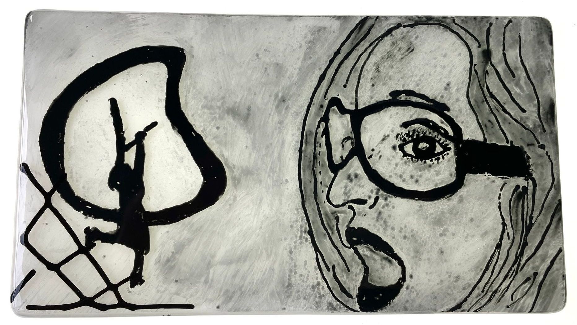 Black-white glass art showing a woman watching a woman hanging from arms of a clock trying to slow down time.