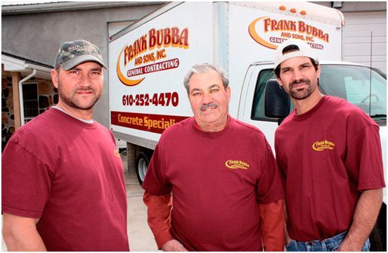 Three men are posing in front of a truck that says frank bubba