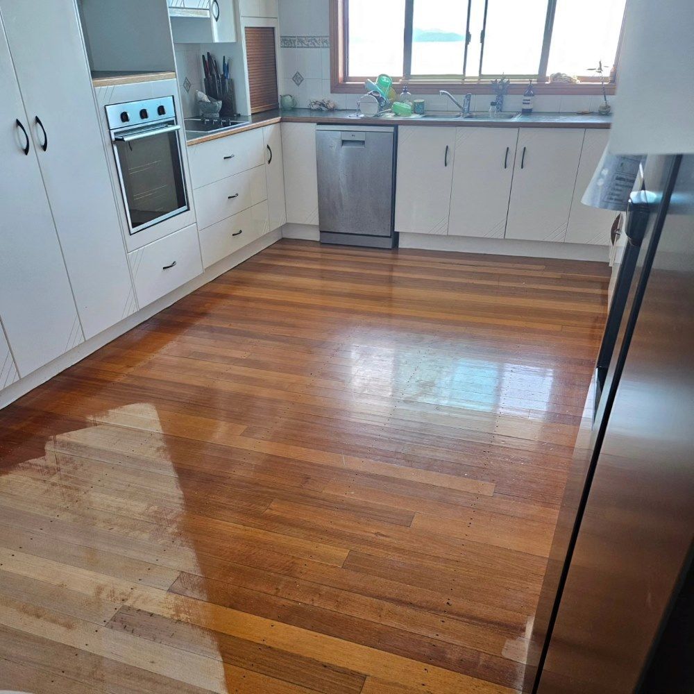 A Room With A Wooden Floor And A Window — ATM Floors In Mount Louisa, QLD A Room With a Wooden Floor and a Window — ATM Floors In Mount Louisa, QLD