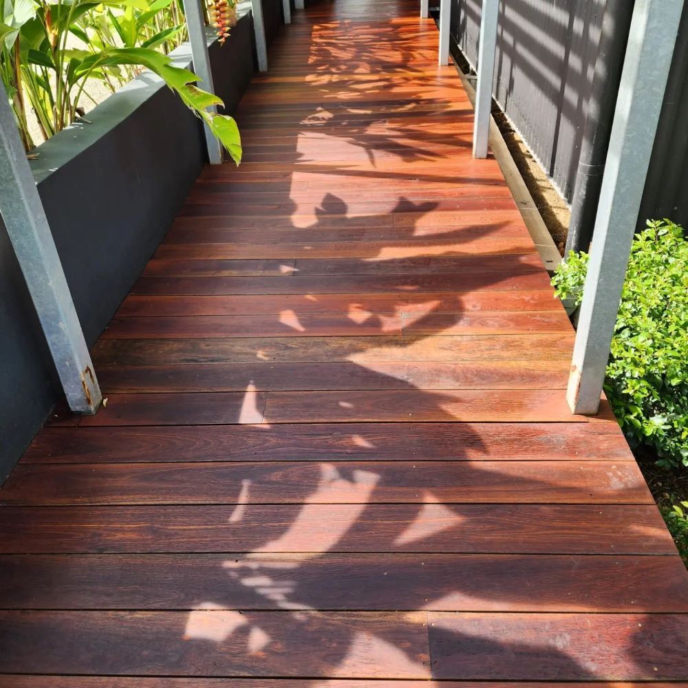 A Living Room With A Wooden Floor And Window— ATM Floors In Ingham, QLD