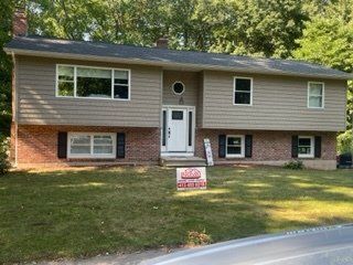 Small House with White Door — Chicopee, MA — Nova Home Improvements