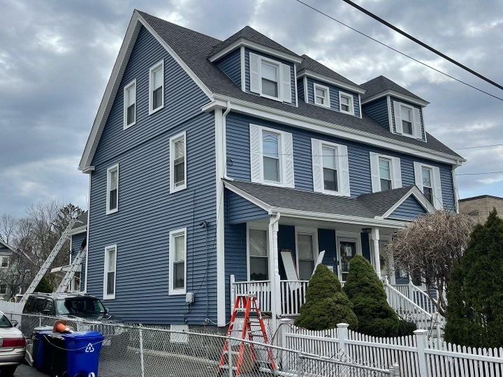 Big House with White Fence — Chicopee, MA — Nova Home Improvements