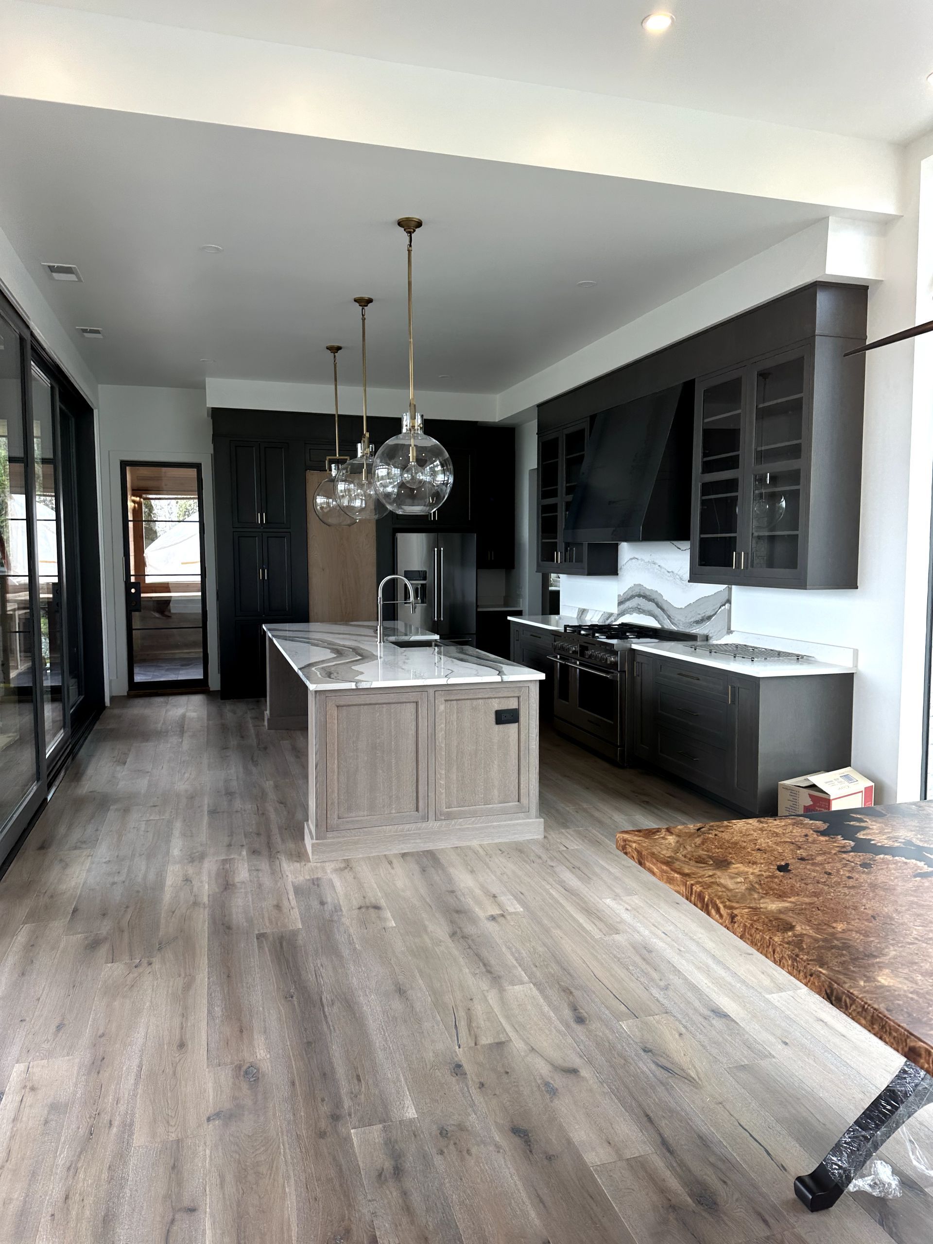 A kitchen with a large island in the middle of the room.