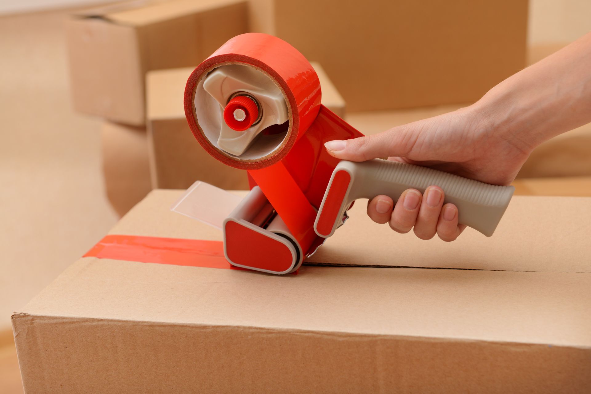 A group of movers are shaking hands with a family in a living room.