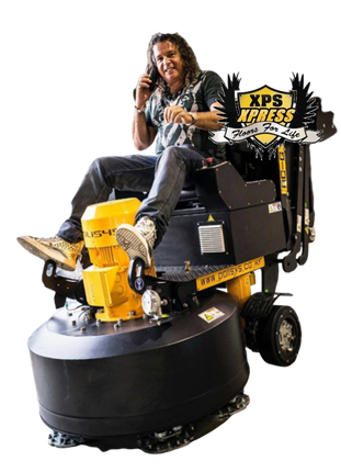 Man on a yellow floor buffer with XPS branding, seated and holding a phone on a white background