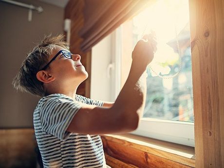 Kid Opening The Window Blind — San Diego, CA — Blind Speed-Sparkle Blinds Kid Opening The Window Blind — San Diego, CA — Blind Speed-Sparkle Blinds