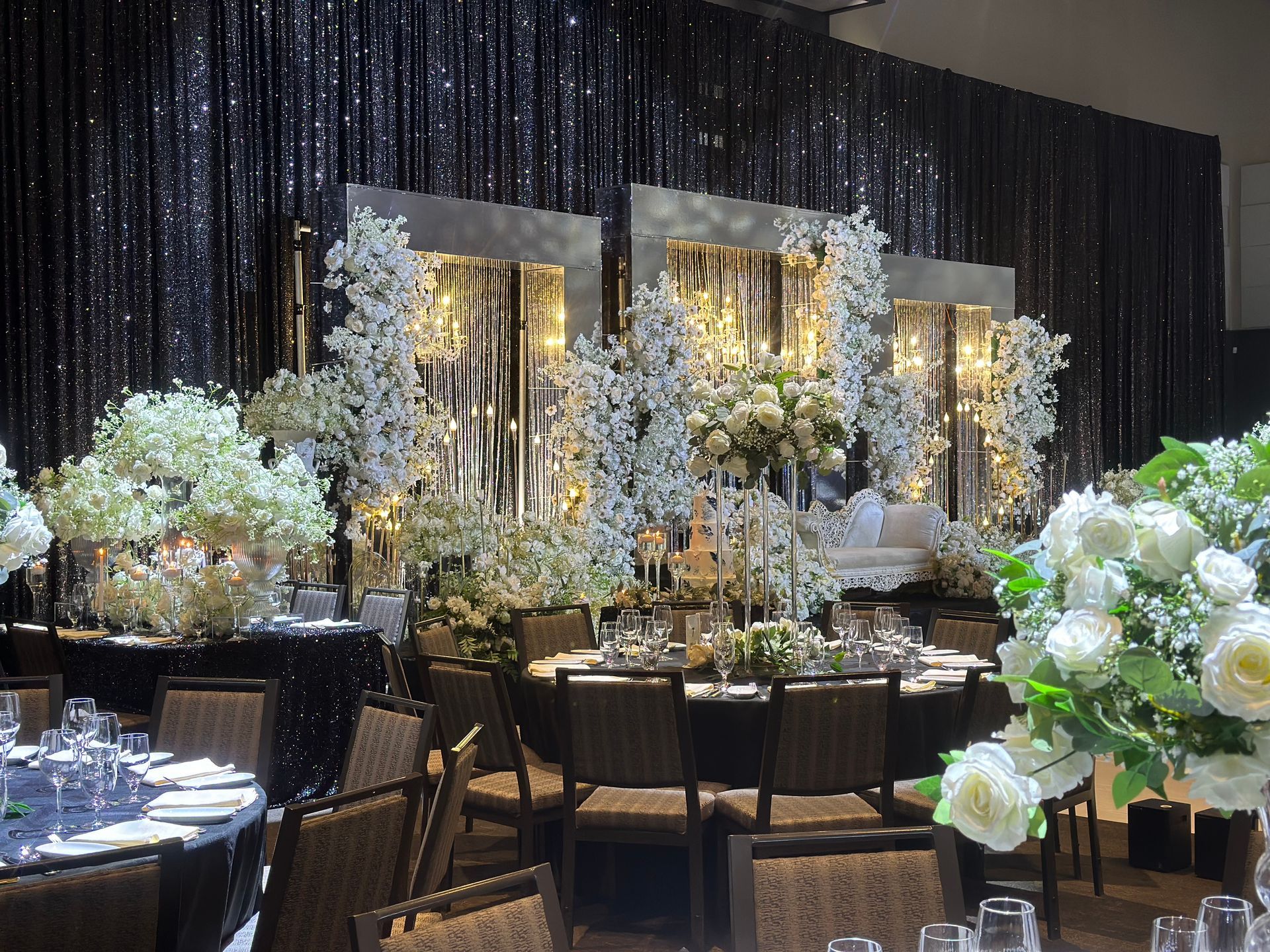 Baraat inspired hues and tones for a wedding reception decor with backdrop and dining sets