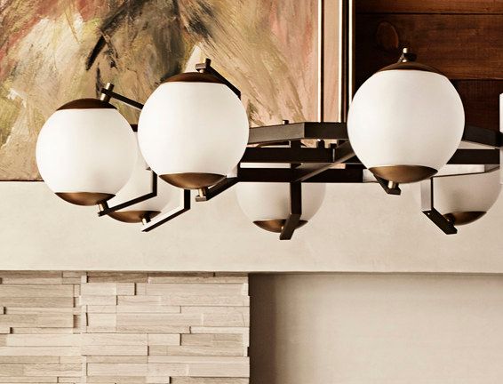 A chandelier with white glass balls hanging from the ceiling