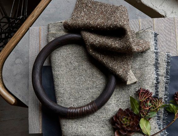 A brown ring is sitting on top of a piece of cloth
