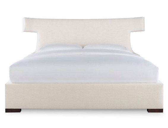 A bed with white sheets and pillows on a white background
