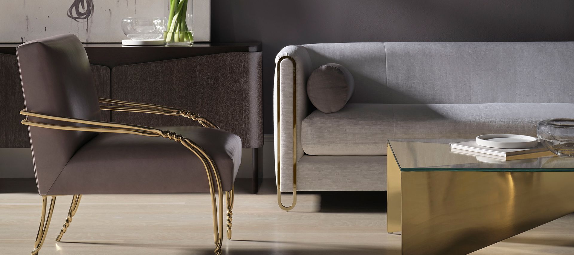 A living room with a couch , chair , and coffee table