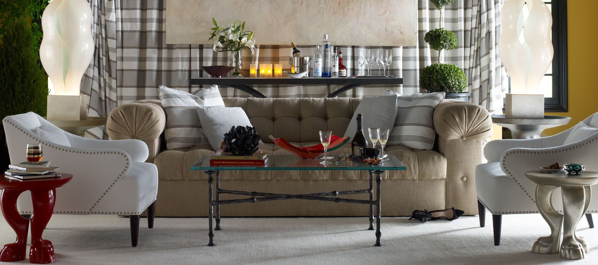 A living room with a couch , chairs and a coffee table