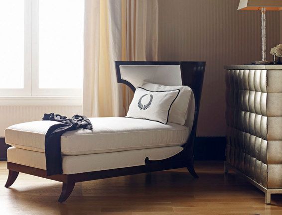 A chair with a pillow that has the letter o on it