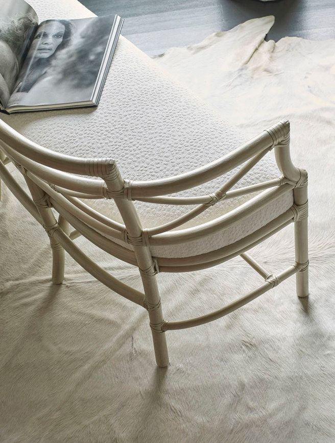 A chair is sitting on a rug next to a magazine